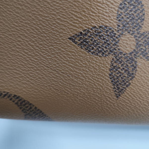 ONTHEGO MM Monogram Coated Canvas Brown