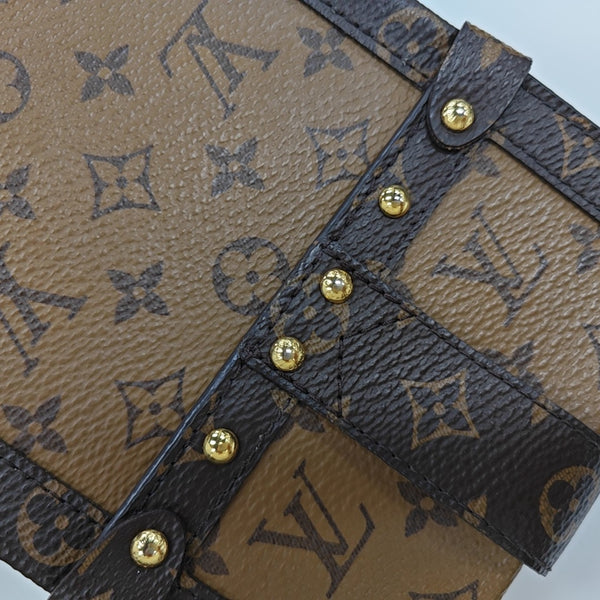 TRUNK Monogram Coated Canvas Brown