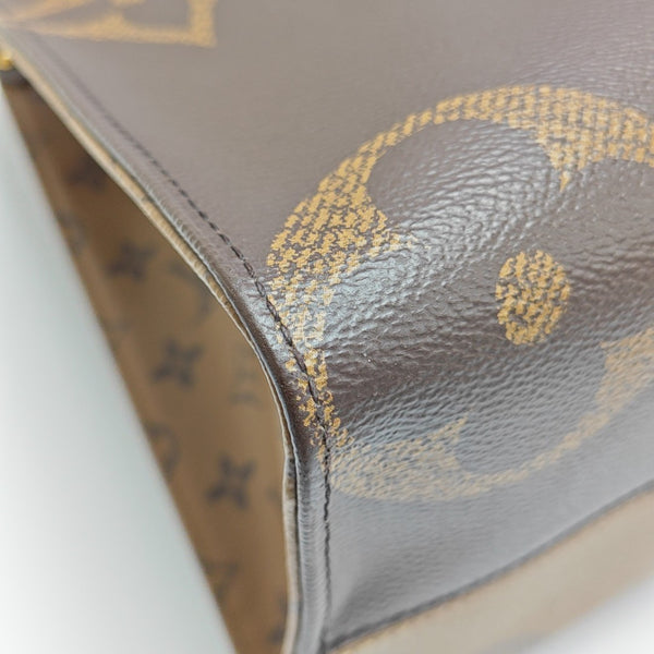 ONTHEGO MM Monogram Coated Canvas Brown