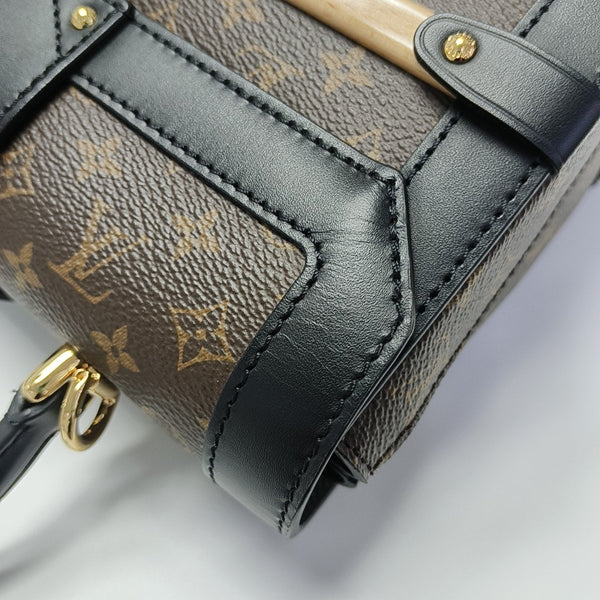 TRIANON PM Monogram Coated Canvas Brown