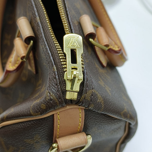 SPEEDY 25 Monogram Coated Canvas Brown