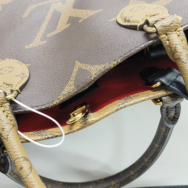 ONTHEGO MM Monogram Coated Canvas Brown