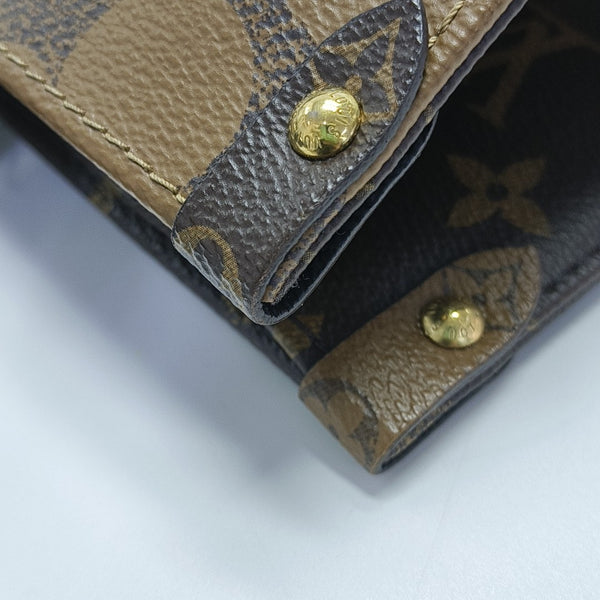 ONTHEGO MM Monogram Coated Canvas Brown