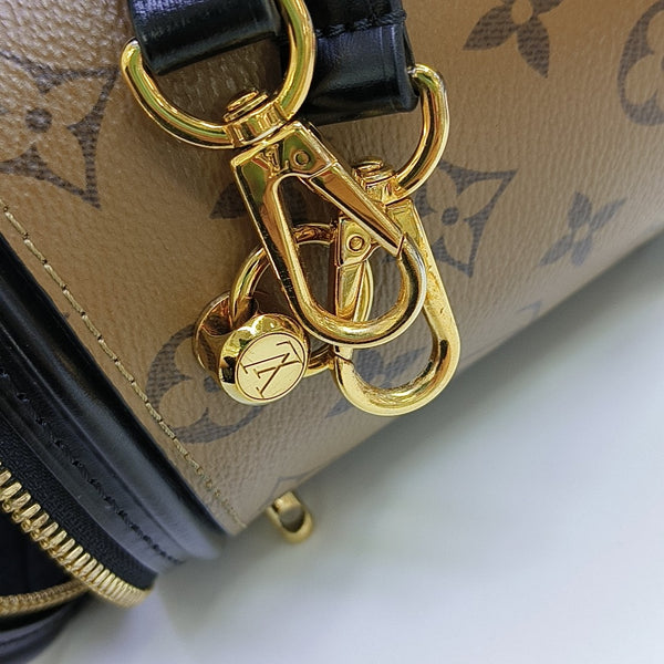 CANNES PM Monogram Coated Canvas Brown