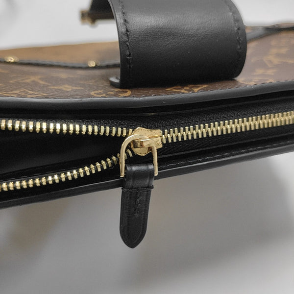 TRUNK Monogram Coated Canvas Brown