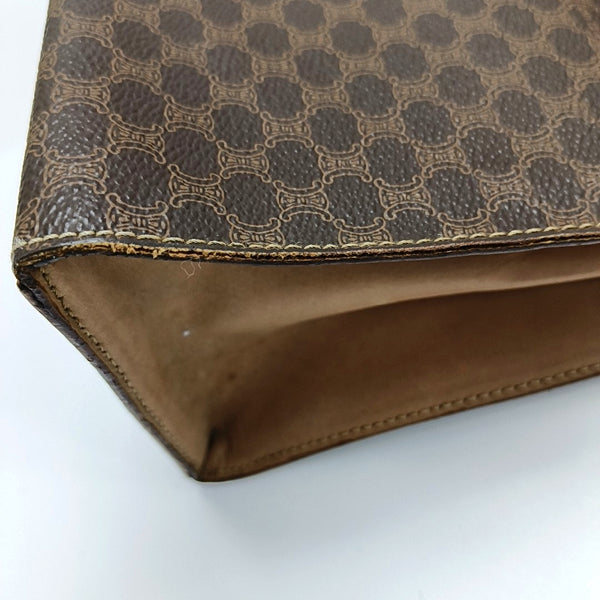 Authenticated pre-owned MACADAM BLASON TRIOMPHE Coated Canvas Brown - Top Handle Bag at Looply