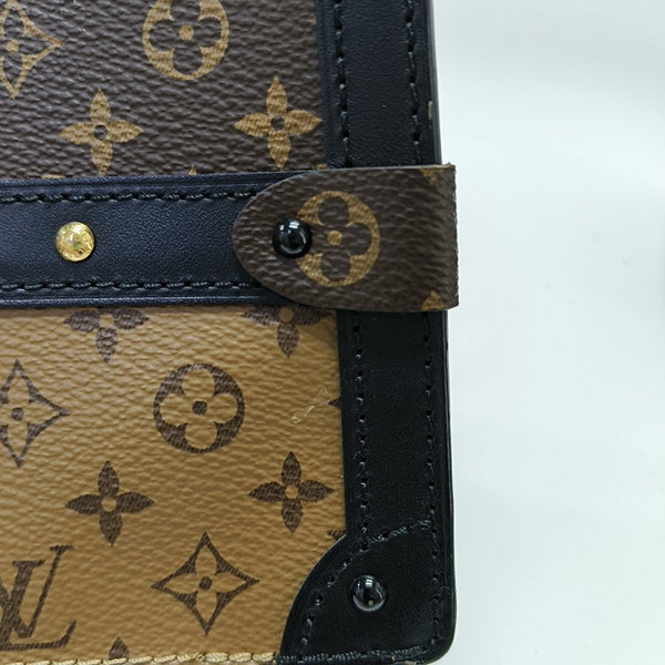 TRUNK Monogram Coated Canvas Brown