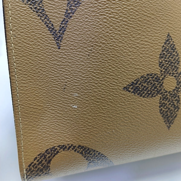 ONTHEGO MM Monogram Coated Canvas Brown