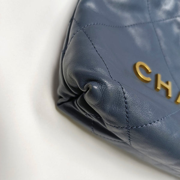 Authenticated pre-owned CHANEL 22 Mini Quilted Calfskin Blue - Bucket Bag at Looply
