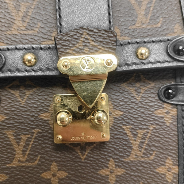 TRUNK Monogram Coated Canvas Brown