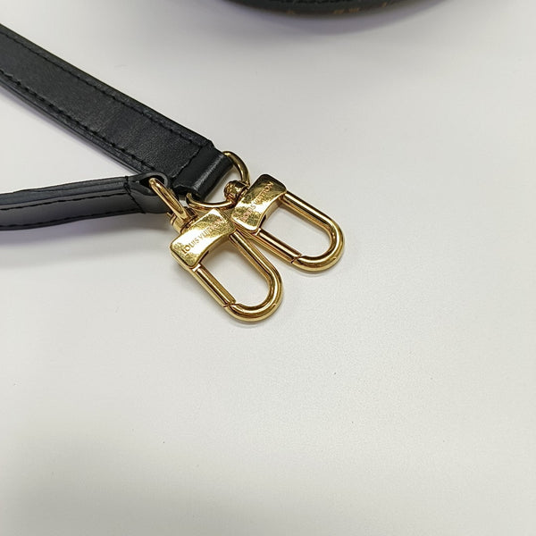 CANOÉ Monogram Coated Canvas Brown
