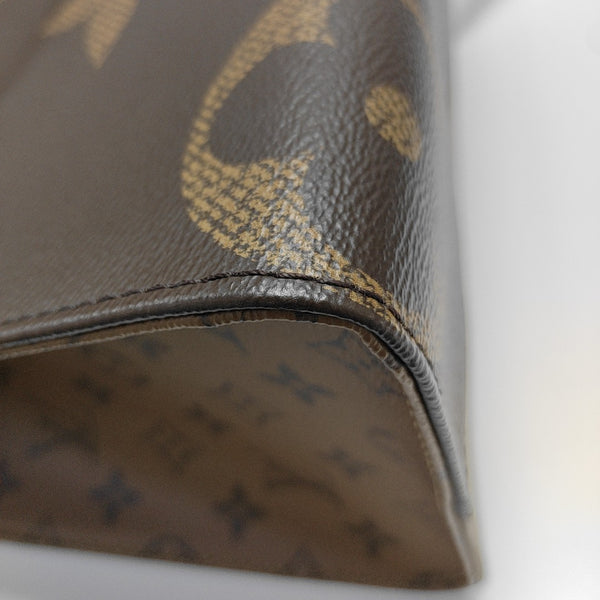 ONTHEGO MM Monogram Coated Canvas Brown