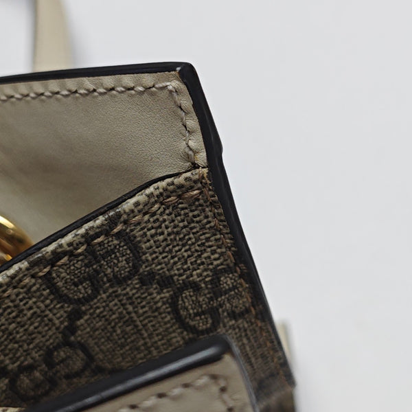 Padlock Small Monogram Coated Canvas Beige