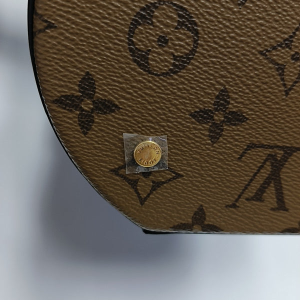 CANNES PM Monogram Coated Canvas Brown