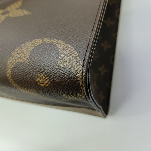 ONTHEGO MM Monogram Coated Canvas Brown