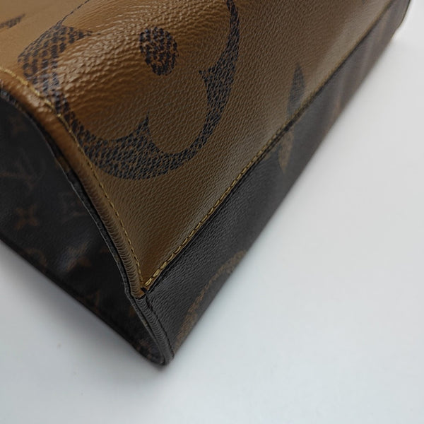 ONTHEGO MM Monogram Coated Canvas Brown