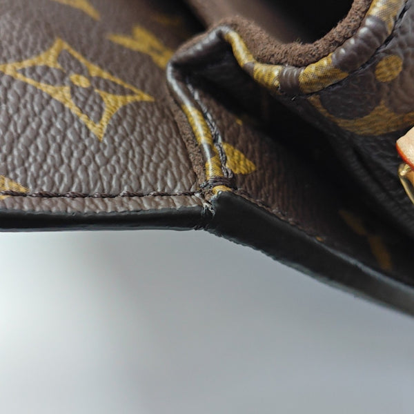 MÉTIS EAST WEST Monogram Coated Canvas Brown