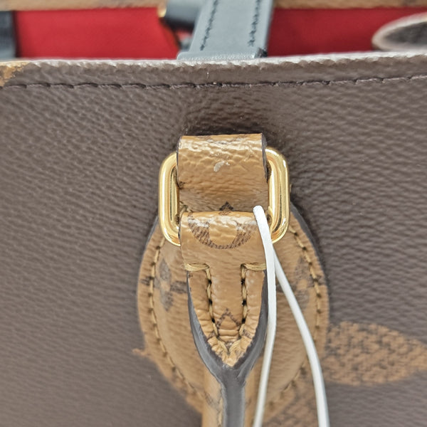 ONTHEGO MM Monogram Coated Canvas Brown