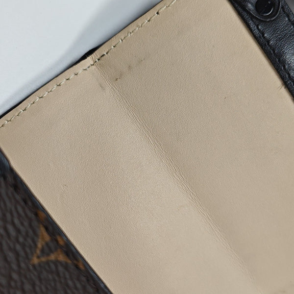 TRUNK Monogram Coated Canvas Brown