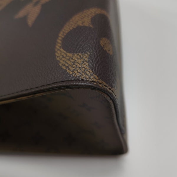 ONTHEGO MM Monogram Coated Canvas Brown