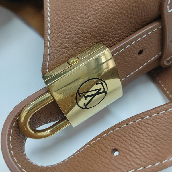 LOW KEY HOBO PM Monogram Calfskin Brown