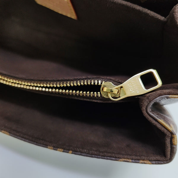MÉTIS EAST WEST Monogram Coated Canvas Brown