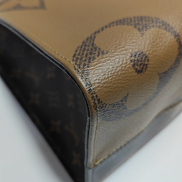 ONTHEGO MM Monogram Coated Canvas Brown