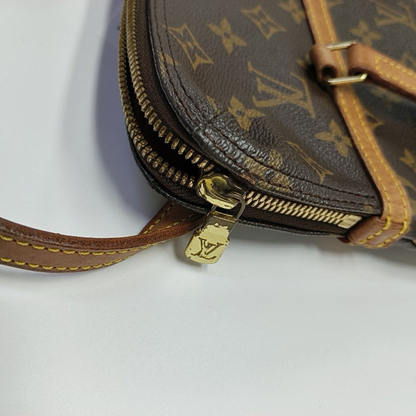COUSSIN GM Monogram Coated Canvas Brown