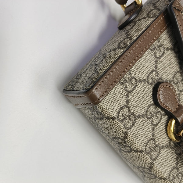 Authenticated pre-owned Horsebit 1955 Mini Monogram Coated Canvas Beige - Shoulder Bag at Looply