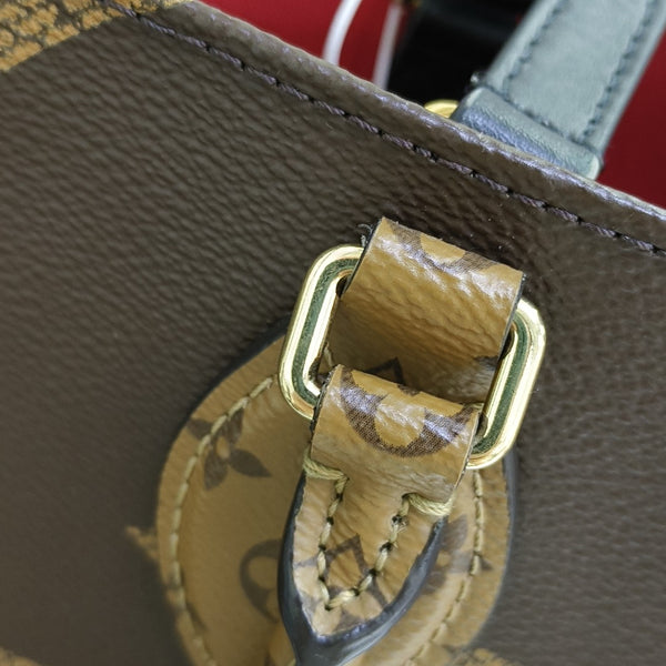 ONTHEGO MM Monogram Coated Canvas Brown