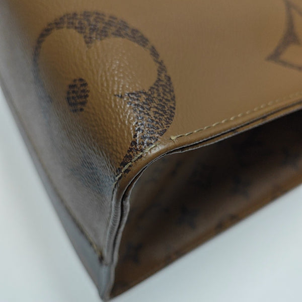 ONTHEGO MM Monogram Coated Canvas Brown
