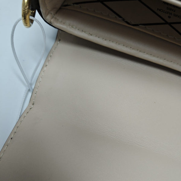 TRUNK Monogram Coated Canvas Brown