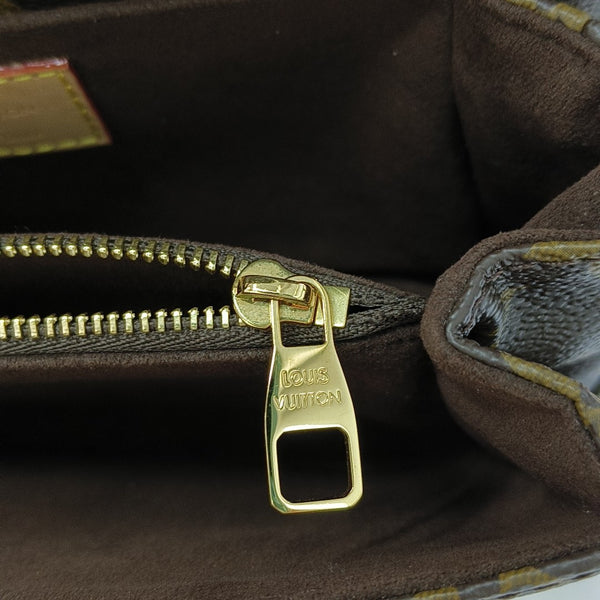 MÉTIS EAST WEST Monogram Coated Canvas Brown