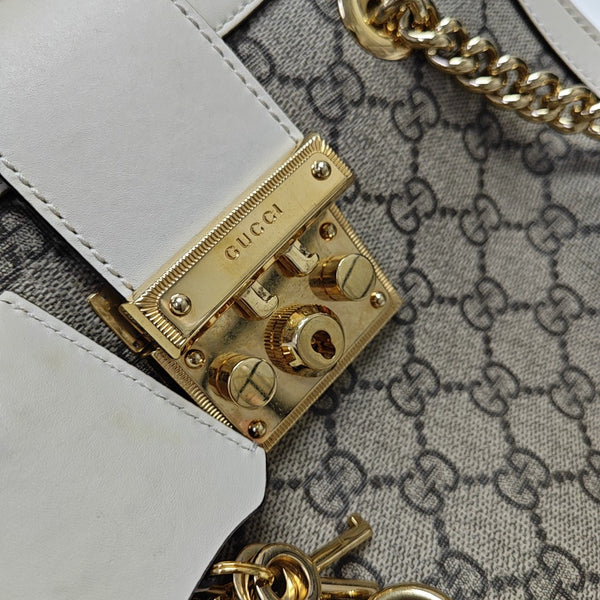 Padlock Small Monogram Coated Canvas Beige