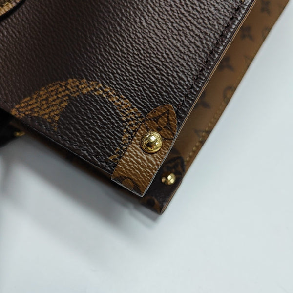 ONTHEGO MM Monogram Coated Canvas Brown