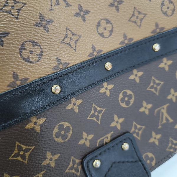 TRUNK Monogram Coated Canvas Brown