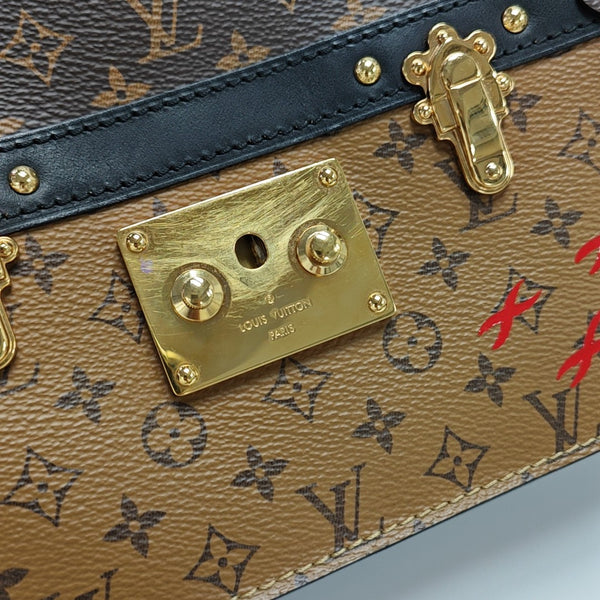 TRUNK Monogram Coated Canvas Brown