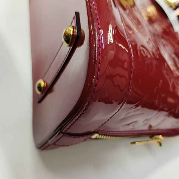 ALMA PM Piel Charol Monogram Roja