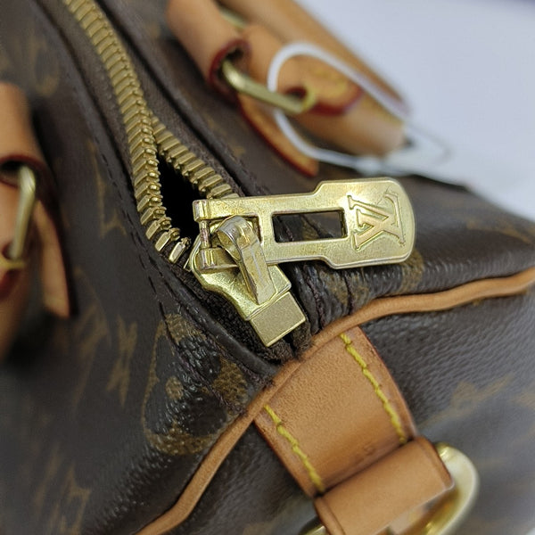 SPEEDY 25 Monogram Coated Canvas Brown