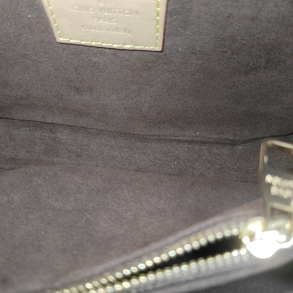 MÉTIS EAST WEST Monogram Coated Canvas Brown