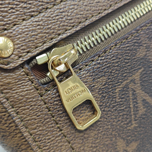 TRUNK Monogram Coated Canvas Brown