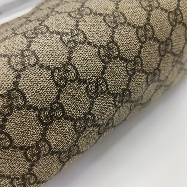 Monogram Coated Canvas Clutch Brown