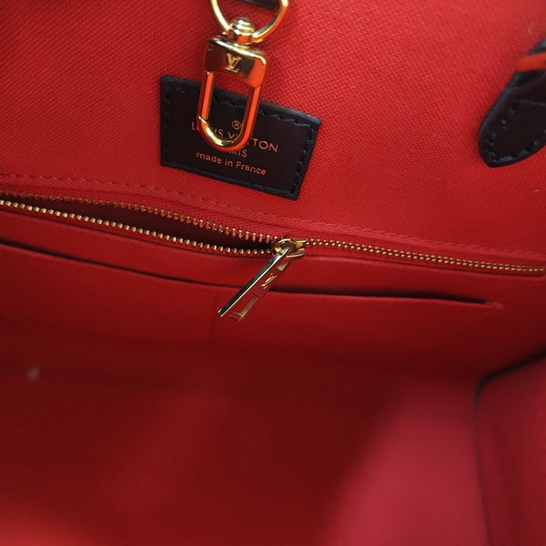 ONTHEGO MM Monogram Coated Canvas Brown