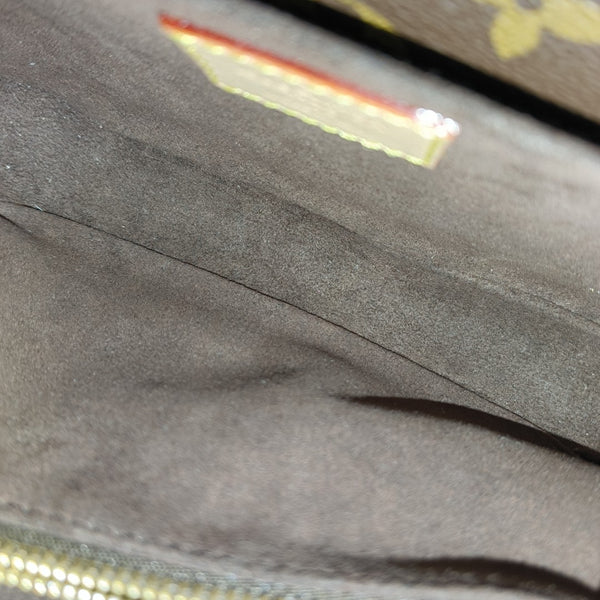 MÉTIS EAST WEST Monogram Coated Canvas Brown