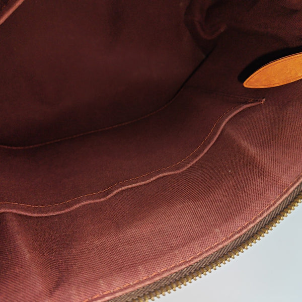 RIVOLI MM Monogram Coated Canvas Brown