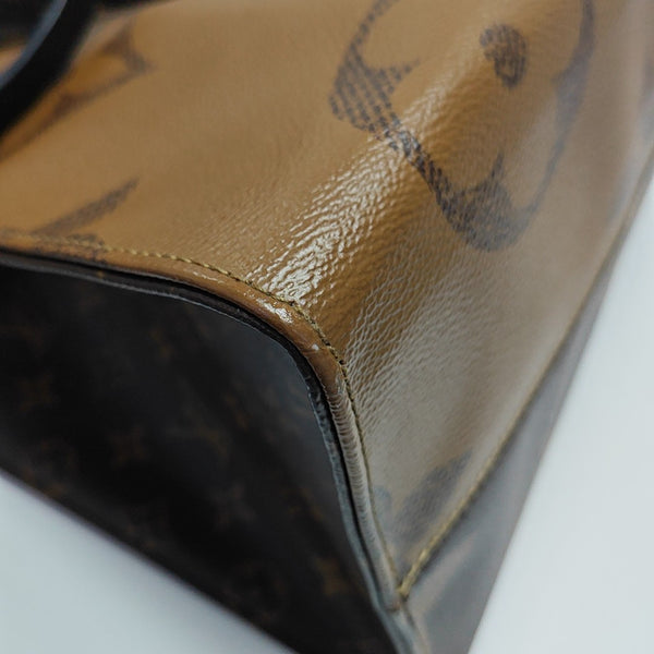 ONTHEGO GM Monogram Coated Canvas Brown