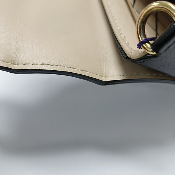 TRUNK Monogram Coated Canvas Brown