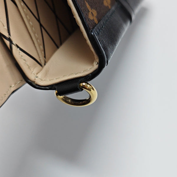 TRUNK Monogram Coated Canvas Brown