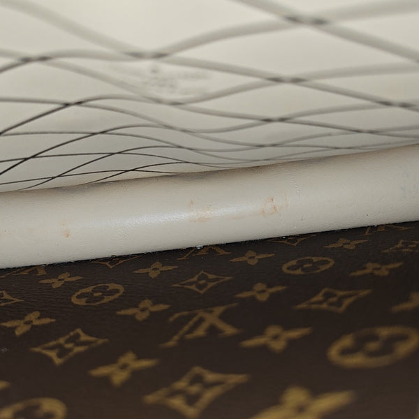 TRUNK Monogram Coated Canvas Brown