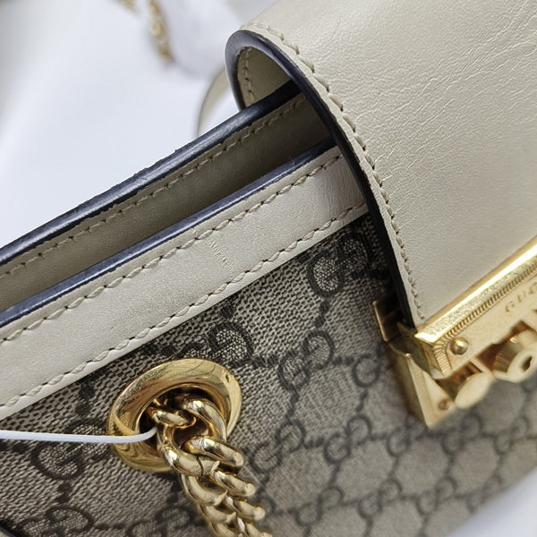 Padlock Small Monogram Coated Canvas Beige